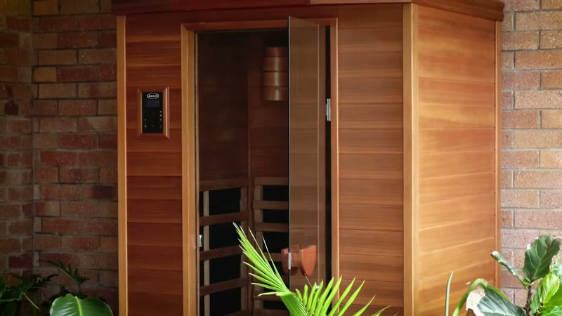 Cedar infrared sauna with green plants